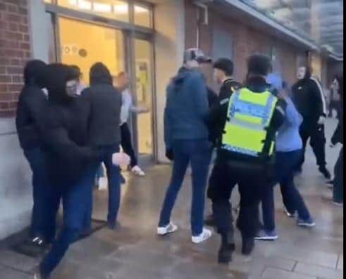 This is the moment a lone police officer broke up a mass brawl at Doncaster railway station. (Photo: Facebook).