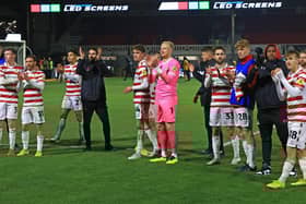 Doncaster Rovers players celebrate after victory against Newport County.