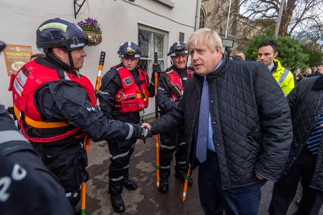 Date: 123th November 2019.
Picture James Hardisty.
The prime minister Boris Johnson, arriving at St Cuthbert's Church, Fishlake, near Doncaster, chatting Yorkshrie and Humber Regional Marine Underwater Search Unit.