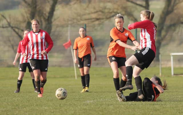 Harworth Colliery Ladies, in orange, in action against Sheffield United Community Foundation. Photo: Julian Barker