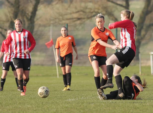 Harworth Colliery Ladies, in orange, in action against Sheffield United Community Foundation. Photo: Julian Barker