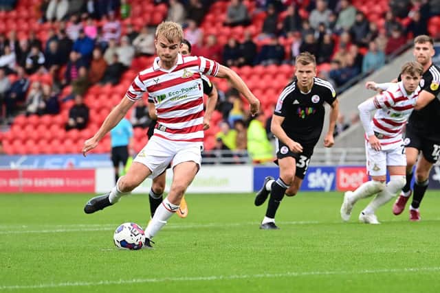 Doncaster's George Miller slots home from the spot against Crawley Town.