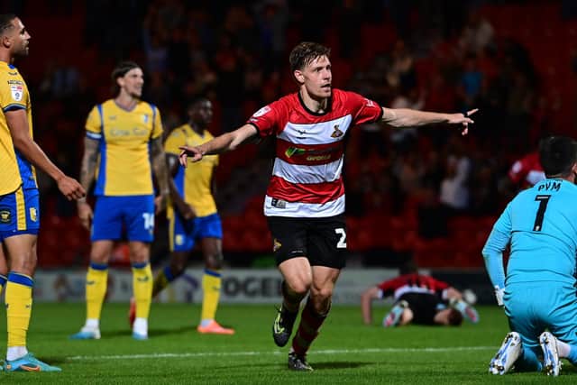 Joe Ironside celebrates opening his account for Doncaster Rovers.