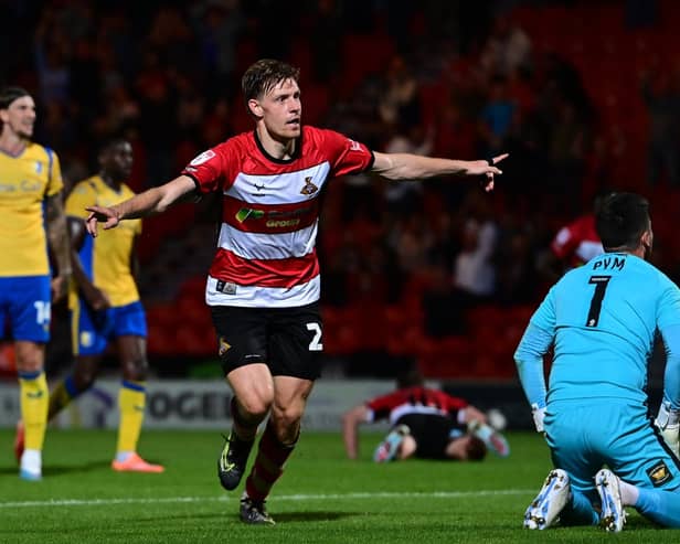 Joe Ironside celebrates opening his account for Doncaster Rovers.