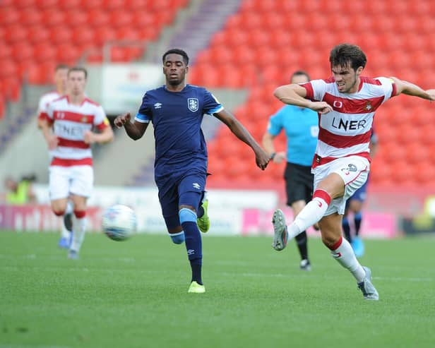 John Marquis in action for Doncaster Rovers.