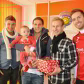 John Oster, Billy Sharp, Simon Gillett and Martin Woods pictured during their visit to the children's ward at Doncaster Royal Infirmary during Christmas 2011.