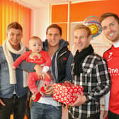 John Oster, Billy Sharp, Simon Gillett and Martin Woods pictured during their visit to the children's ward at Doncaster Royal Infirmary during Christmas 2011.