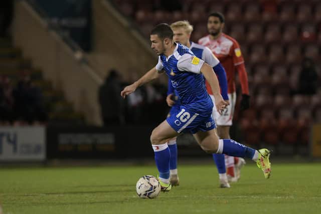 Doncaster's Tommy Rowe drives forward against Crewe Alexandra in the Papa John's Trophy last season.
