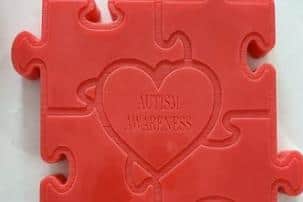The wax melts read 'Autism Awareness.'