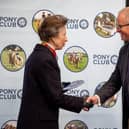 HRH Princess Anne presents Andrew Stennett with anniversary plaque.