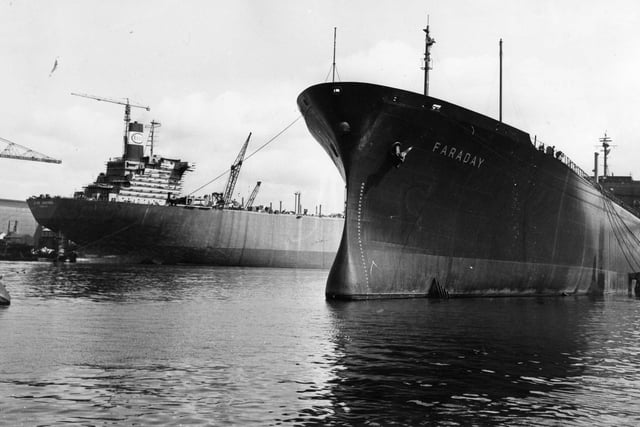 Back to 1970 and the 253,000-ton giant tanker Esso Hibernia at Wallsend Shipyard, and in the foreground the 22,940-ton liquefied gas carier Faraday at Hebburn Shipyard.