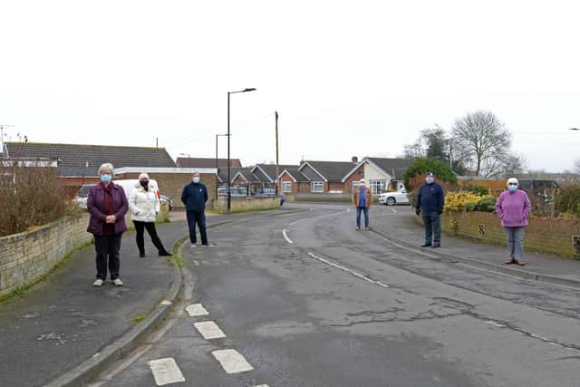 L-r Concerned residents Lesley Illman, Julie Marley, Colyn Firth, Francis Jackson, Town Councillor and Mayor of Askern, John McLaughlin, Town Councillor and Iris Beech, Askern and Norton ward Councillor, pictured on Coniston Road by one of the bends the Buses have to navigate.  Picture: NDFP-02-03-21 Coniston Buses 4-NMSY