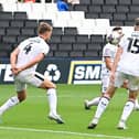 Luke Molyneux scores for Doncaster Rovers to halve the deficit against MK Dons.