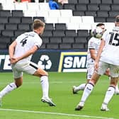 Luke Molyneux scores for Doncaster Rovers to halve the deficit against MK Dons.
