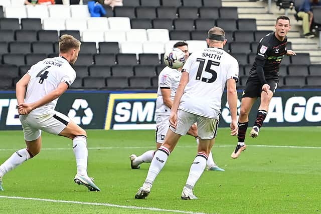 Luke Molyneux scores for Doncaster Rovers to halve the deficit against MK Dons.