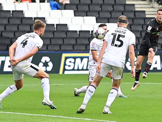 Luke Molyneux scores for Doncaster Rovers to halve the deficit against MK Dons.
