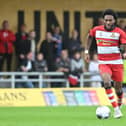 Doncaster Rovers have signed former Manchester United youngster Deji Sotona on a two-year deal following a trial.