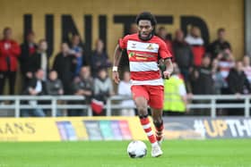 Doncaster Rovers have signed former Manchester United youngster Deji Sotona on a two-year deal following a trial.