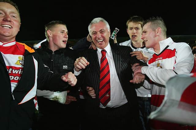 John Ryan is mobbed by Rovers fans following the play-off win over Southend United in 2008. Photo: Matthew Lewis/Getty Images