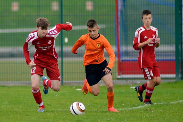 Action from the Doncaster & District Junior Sunday Football League.