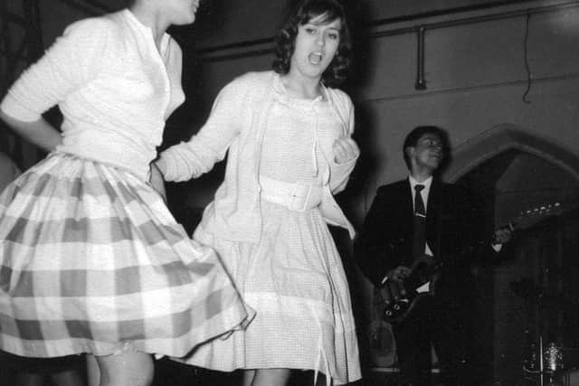 Girls dancing to the Dominoes playing in 1961