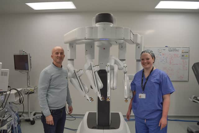Colorectal Robotic Surgery Team pictured with the Da Vinci Surgical XI robot.