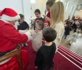 Father Christmas giving out presents