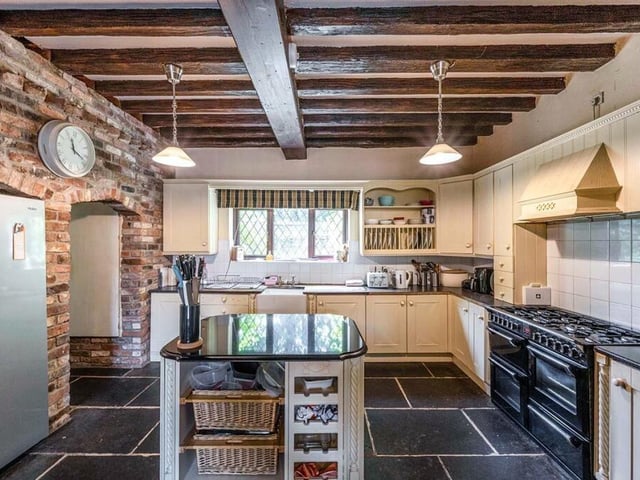 A well-equipped, rustic-style kitchen.