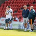 James and Harry sort their tactics on the touchline. Photo: John Hobson/AHPIX LTD