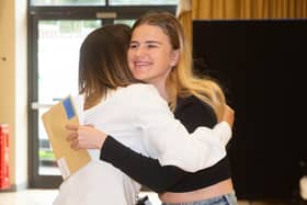 Teacher Cheryl Tindale with a hug for top performing student Maisie Hinchliffe at Trinity Academy in Thorne