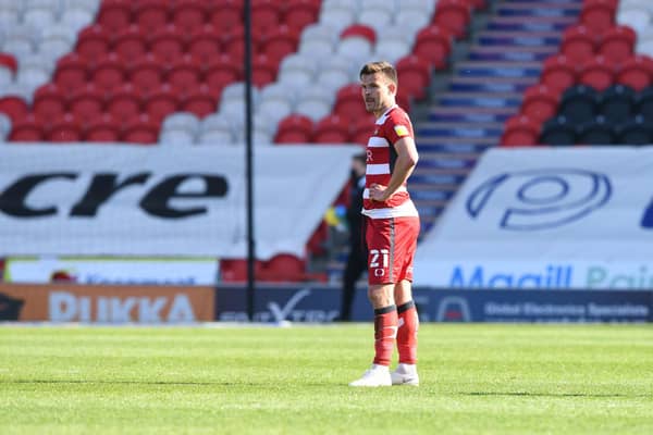 Andy Butler cuts a lonely figure after the defeat to Fleetwood. Picture: Howard Roe/AHPIX