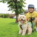 Lucca is pictured at Dogs Trust Leeds with nine month old Cockerpoo, Ralph, one of the rescue dogs his fundraising will help.
