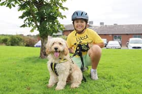 Lucca is pictured at Dogs Trust Leeds with nine month old Cockerpoo, Ralph, one of the rescue dogs his fundraising will help.