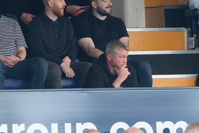 Doncaster Rovers boss Grant McCann watched the match from the stands due to a touchline ban.
