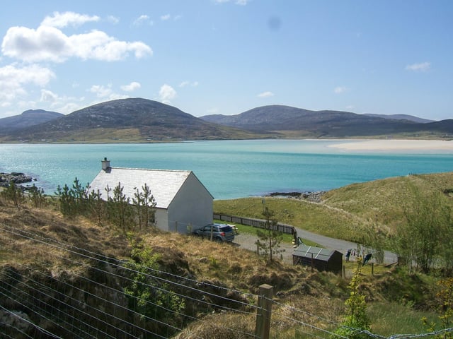 A wonderful detached cottage overlooking the world famous Luskentyre Beach. The property was built in 2003 and has been run as a successful holiday cottage. It offers a large bright open plan living space, with three bedrooms and a bathroom. Currently on sale for 250,000 GBP via Hebridean Estate Agency.
