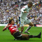 Bradley Johnson of Leeds United battles with Jason Price of Doncaster Rovers during the Coca Cola League 1 Playoff final (photo by Clive Rose/Getty Images).