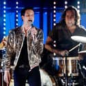The Killers (L-R) guitarist Dave Keuning, singer Brandon Flowers and drummer Ronnie Vannucci perform in 2008 (Photo: Ethan Miller/Getty Images)