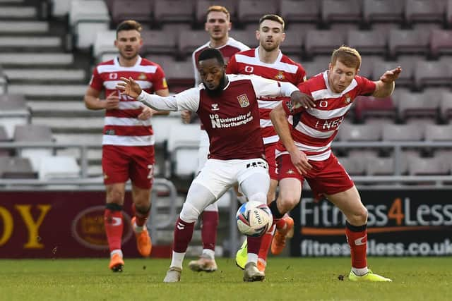 Brad Halliday battles with Northampton's Mark Marshall. Picture: Andrew Roe/AHPIX