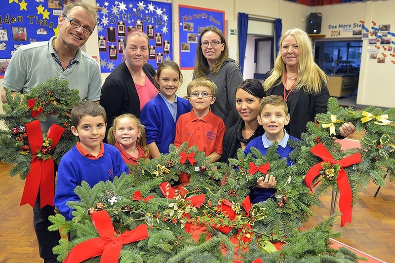 A community wreath making day was held at the school in 2014. Pictured rear left to right are Stuart White, Melanie Harriman, Amanda Hill and Sue Wilson with (front left to right) Matthew Hill, Madisyn Harriman, Angelique Wilkinson, Jacob Hill, Cassie Wilkinson and Will Wilkinson.