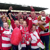 Doncaster Rovers fans celebrate victory over Dagenham and Redbridge in the play-off final, May 10, 2003