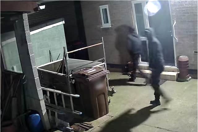 CCTV of two of the men at a house in Maltby.