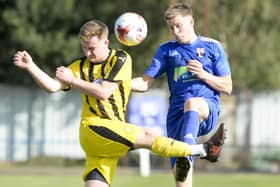 Rossington's Harry Atkinson challenges for possession during Rossington's defeat to Nostell MW.