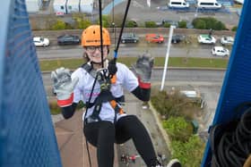 Thrill-seekers take 160ft plunge raising over £11,800 for hospital charity.