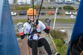 Thrill-seekers take 160ft plunge raising over £11,800 for hospital charity.