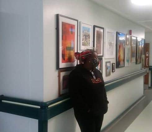 Chinwe in DRI with the art work hung in the corridors.