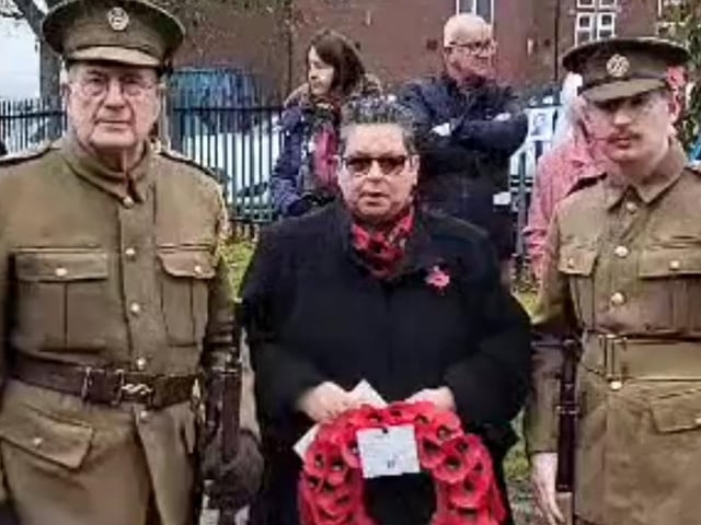 Councillor Bev Chapman after laying a wreath in Mexborough with David and Ben McCabe in their original uniforms.