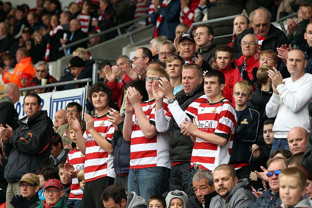 35 great snaps of Doncaster Rovers loyal fans proudly showing their colours over the years