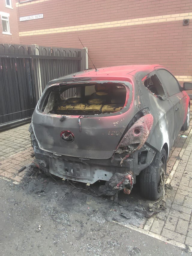 One of two cars torched at a Doncaster flats complex.