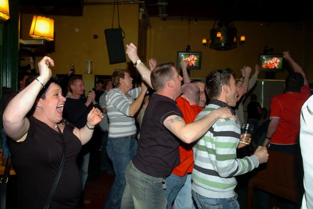Fans celebrating Doncaster's victory.