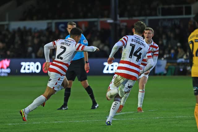 Doncaster Rovers' Kyle Knoyle celebrates his goal against Newport County.